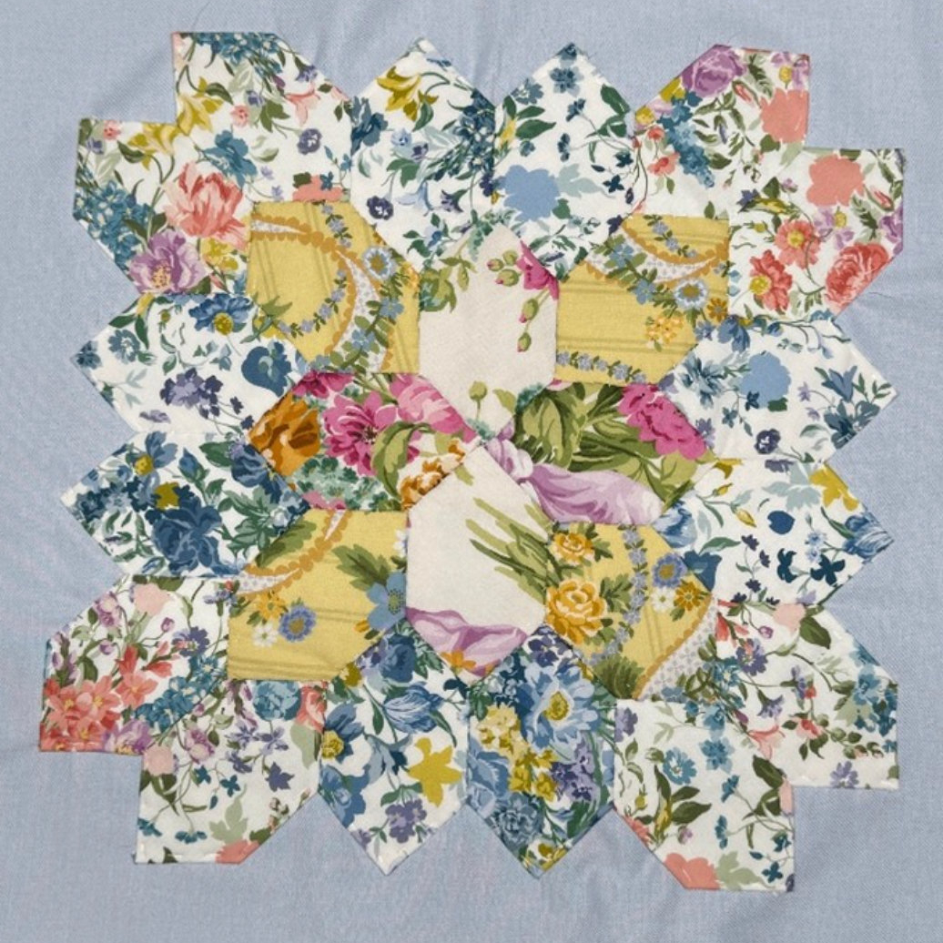Grey and yellow patchwork quilt